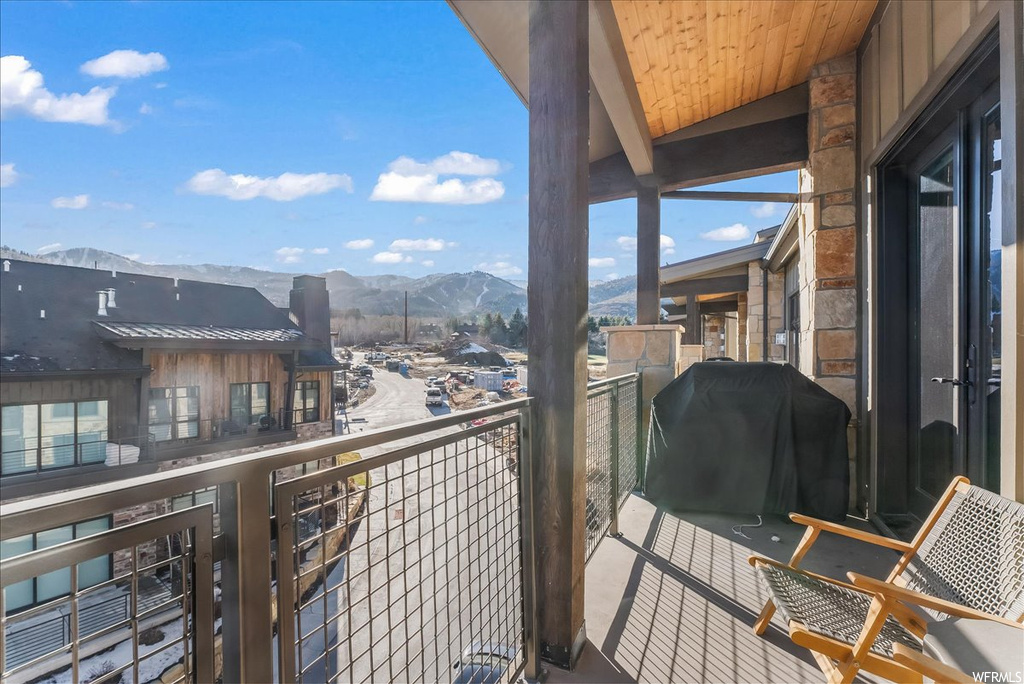 Balcony with grilling area and a mountain view