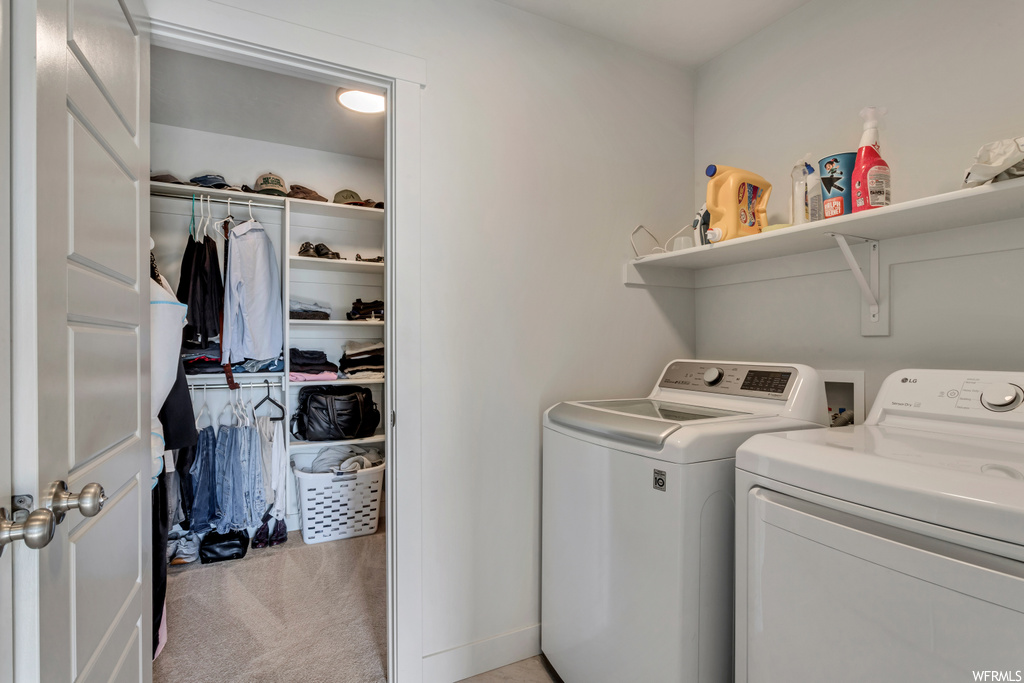 Clothes washing area with hookup for a washing machine, washing machine and dryer, and light carpet