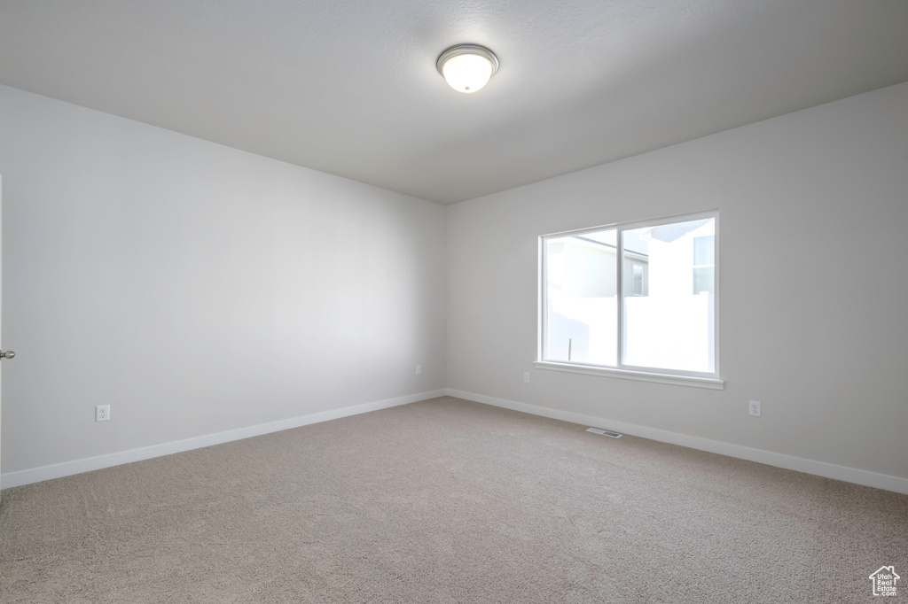 Empty room with carpet floors