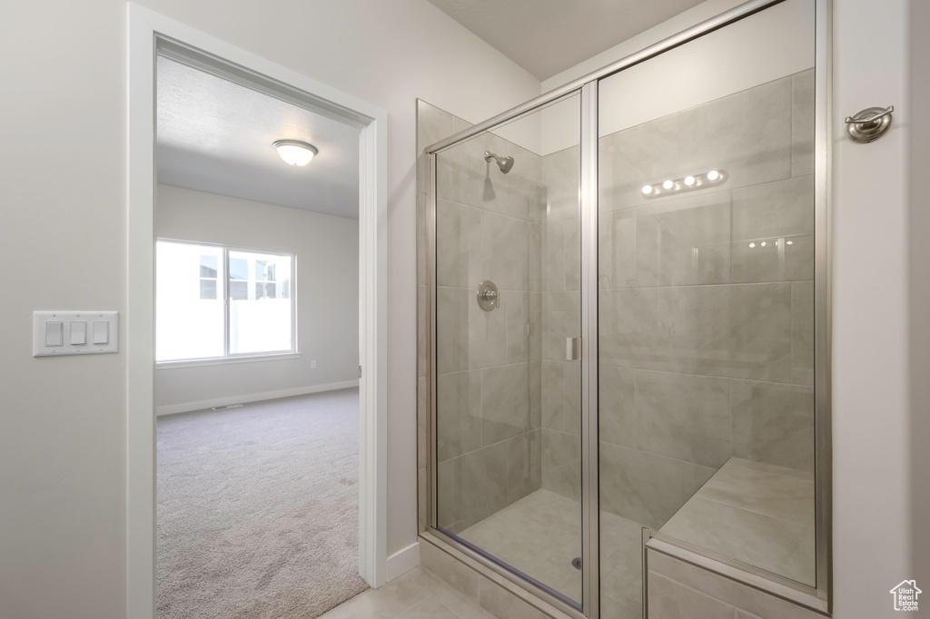 Bathroom featuring a shower with shower door