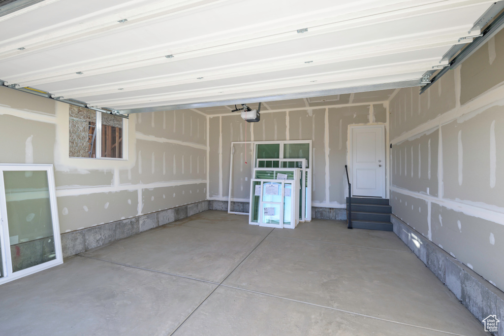 Garage featuring a garage door opener