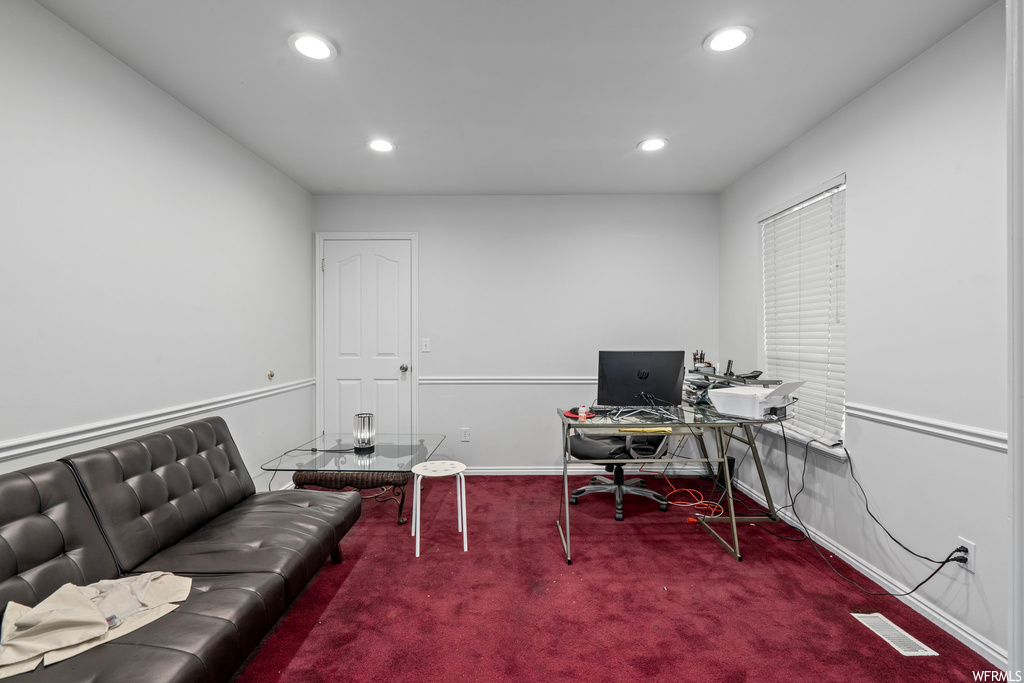 Office area with dark colored carpet
