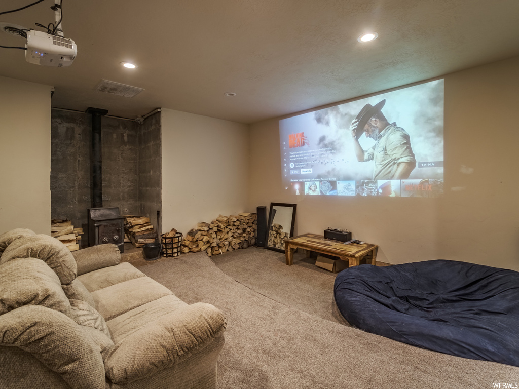 Carpeted cinema with a wood stove