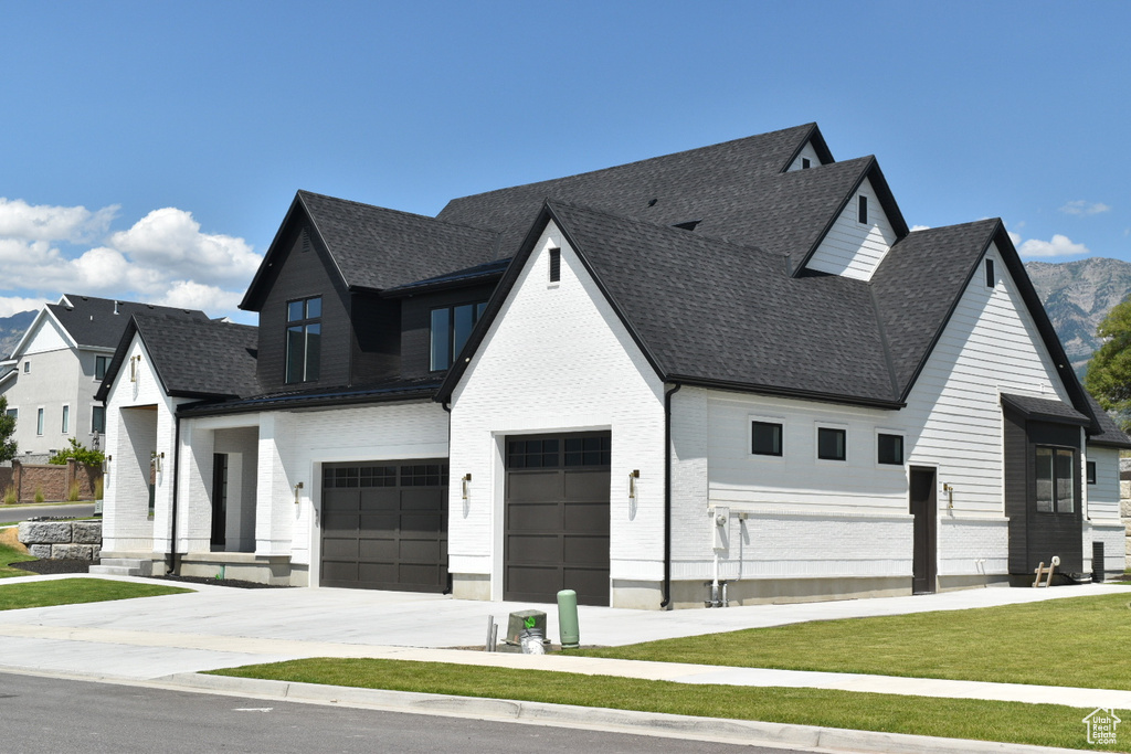 View of front of home featuring a garage