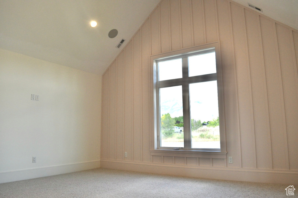 Bonus room featuring carpet flooring and lofted ceiling