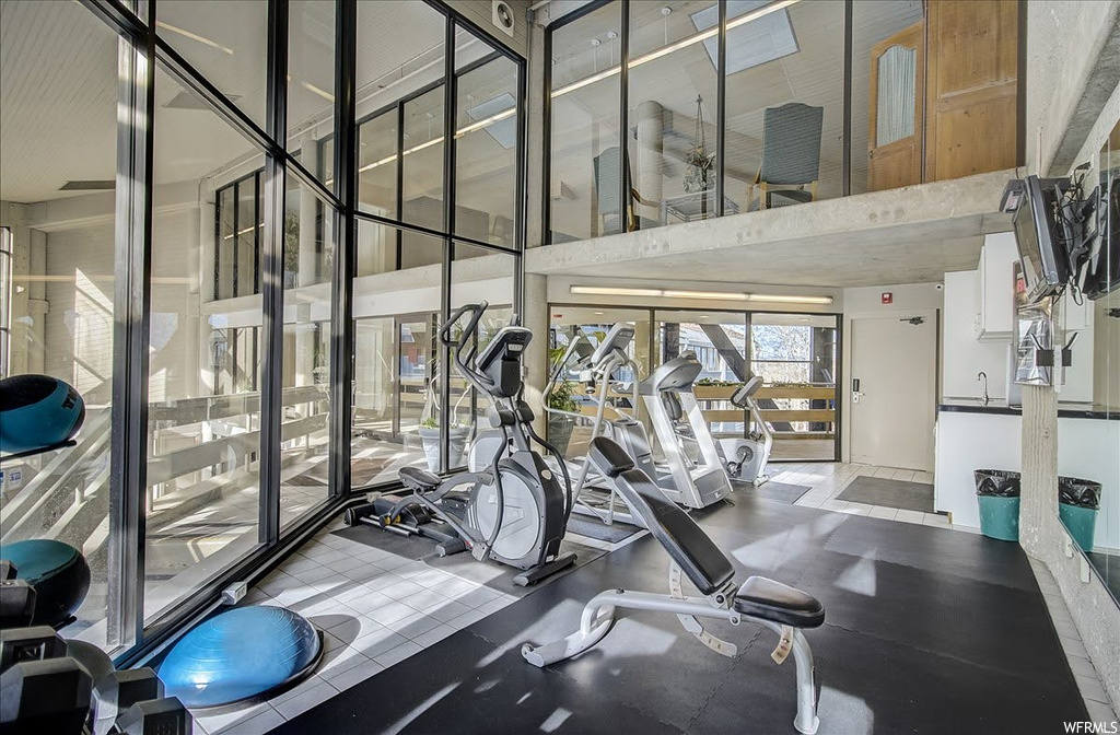 Workout area with a towering ceiling
