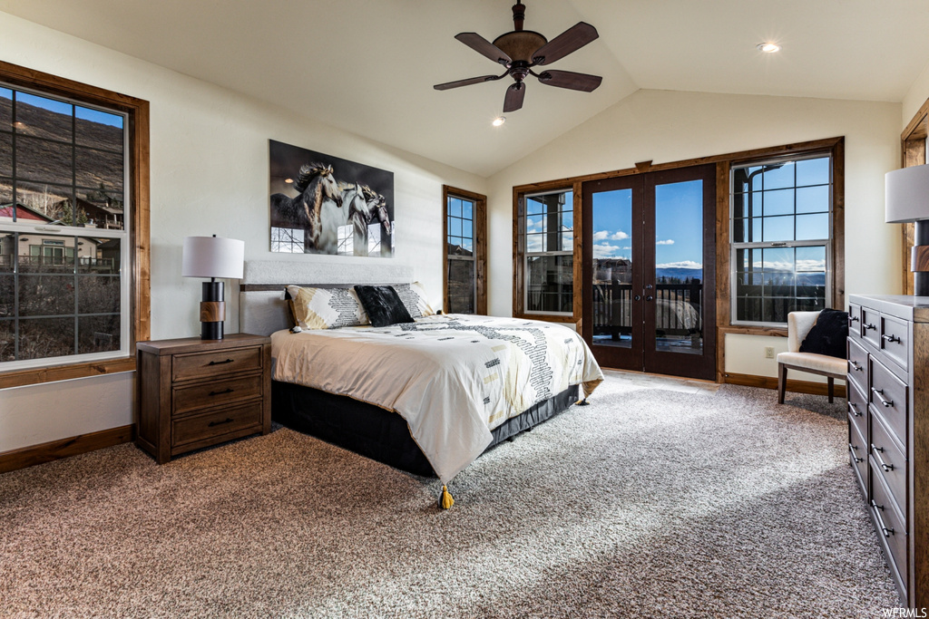 Carpeted bedroom featuring ceiling fan, access to outside, french doors, and vaulted ceiling