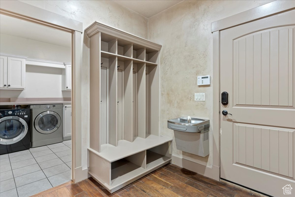 Mudroom with washing machine and clothes dryer and tile flooring