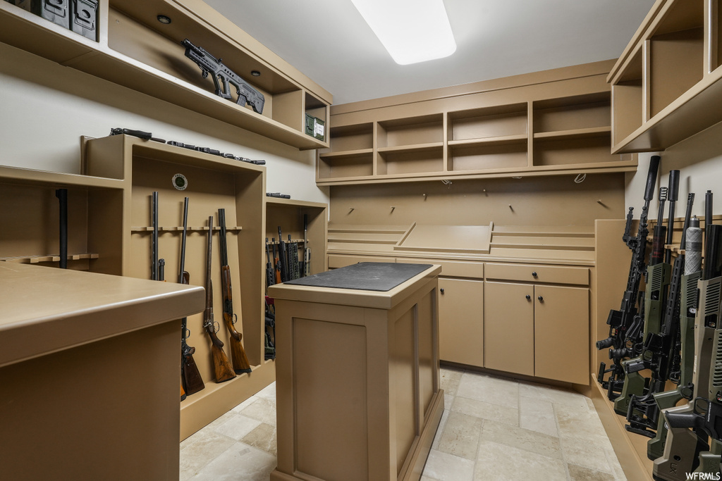 Spacious closet with light tile floors