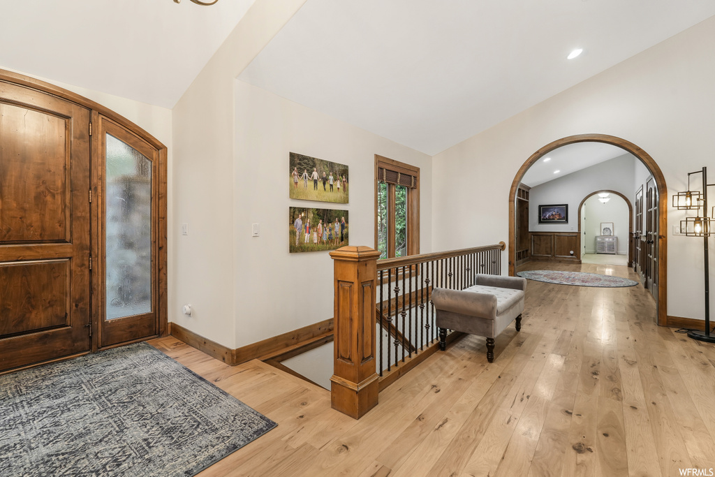 Entryway featuring light hardwood / wood-style floors and vaulted ceiling