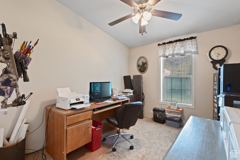 Carpeted office featuring ceiling fan and vaulted ceiling