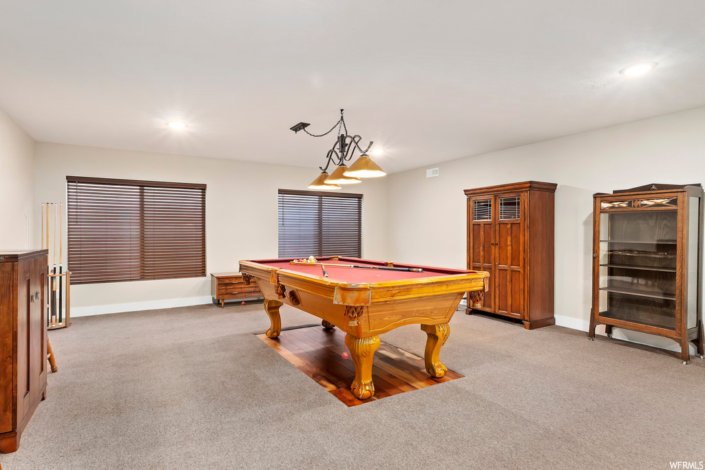 Recreation room with billiards and light colored carpet