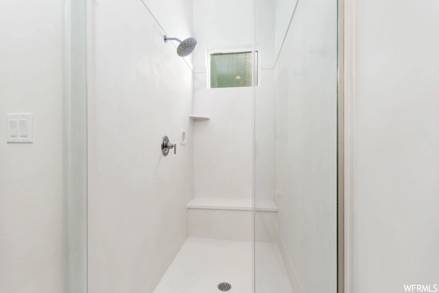 Bathroom featuring walk in shower