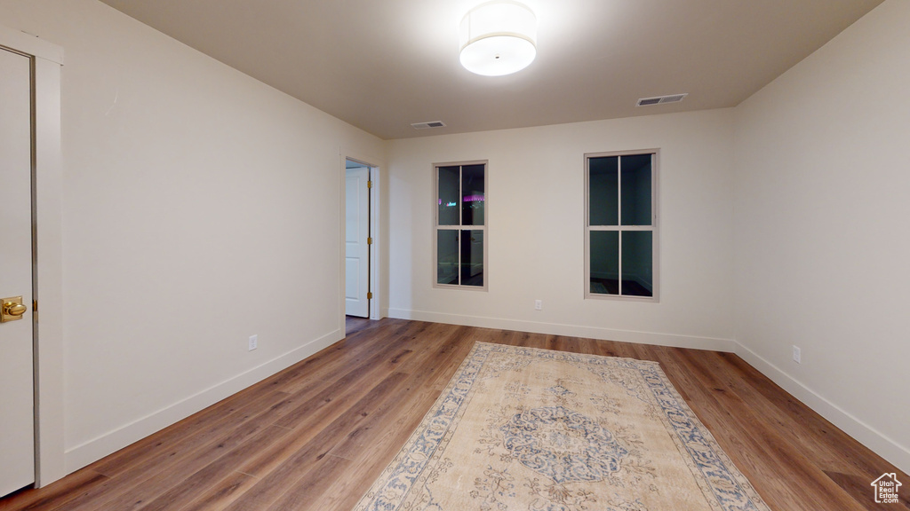 Unfurnished room with hardwood / wood-style floors