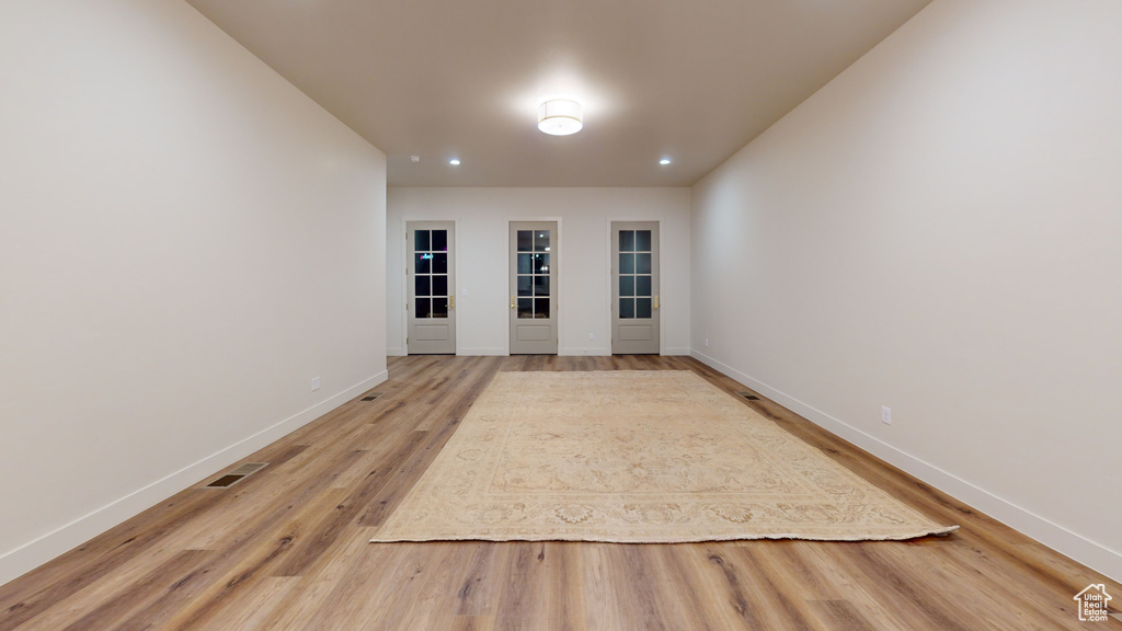 Spare room with hardwood / wood-style flooring