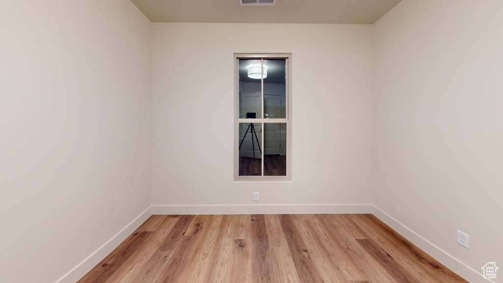 Empty room featuring light hardwood / wood-style flooring