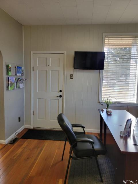 Office space featuring dark wood-type flooring