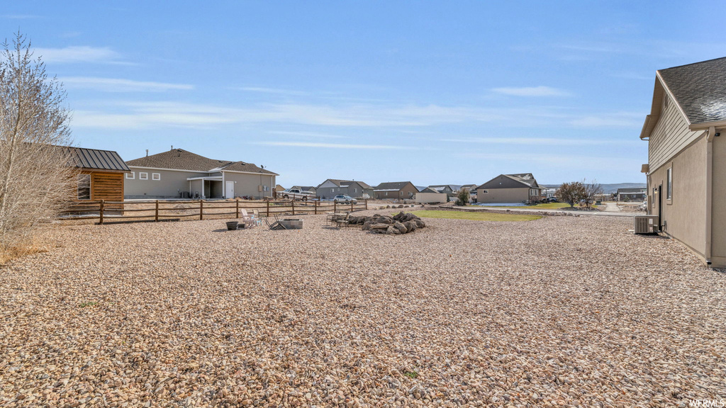 View of yard featuring central AC unit