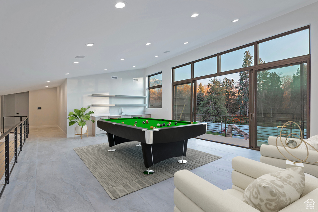 Recreation room featuring pool table and light tile floors