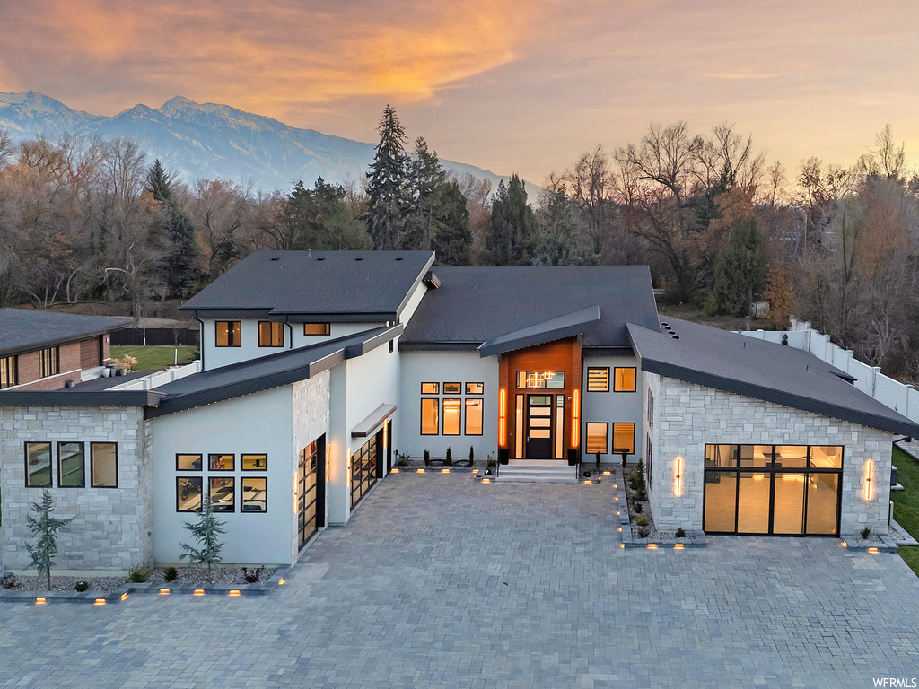 Contemporary home with a garage and a mountain view