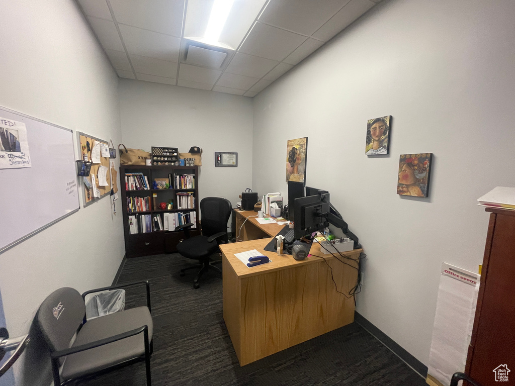 Office with a paneled ceiling