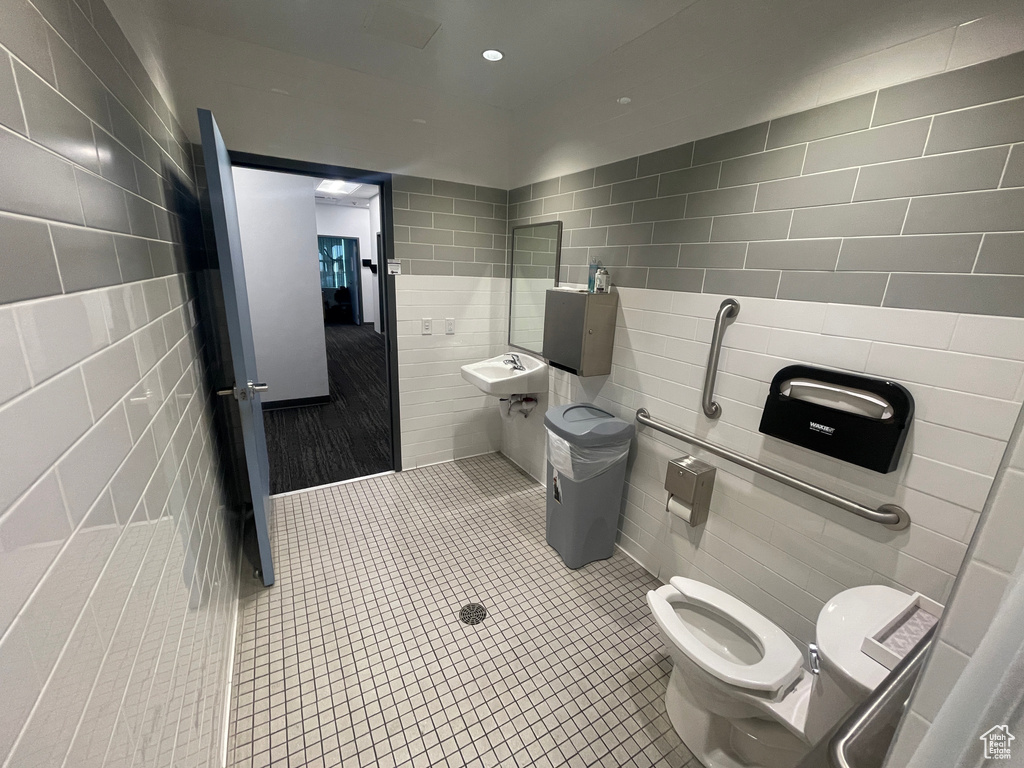 Bathroom with tile walls and tile patterned flooring
