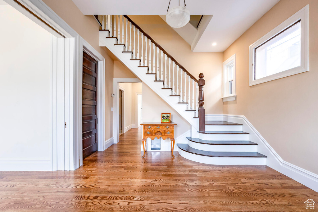 Staircase with hardwood / wood-style flooring