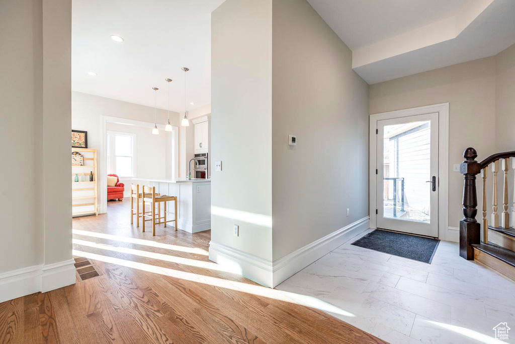 Foyer entrance featuring light hardwood / wood-style flooring