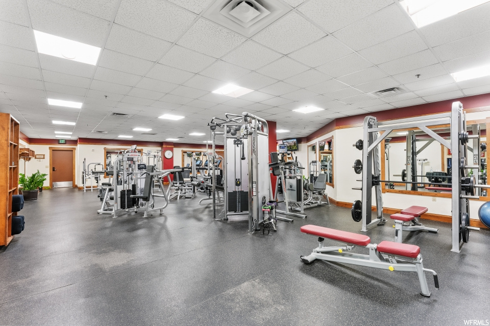 Workout area with a paneled ceiling