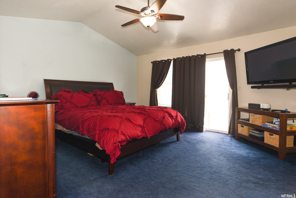 Carpeted bedroom featuring lofted ceiling, ceiling fan, and access to outside