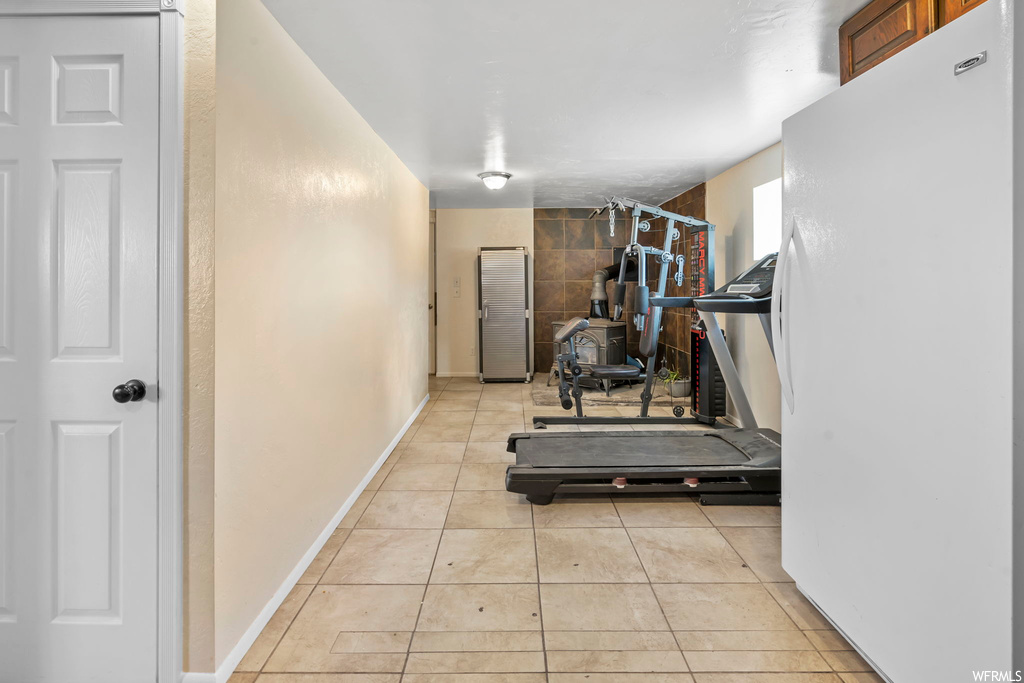 Workout area with light tile flooring