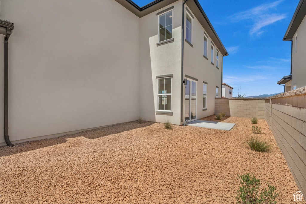 Rear view of house featuring a patio