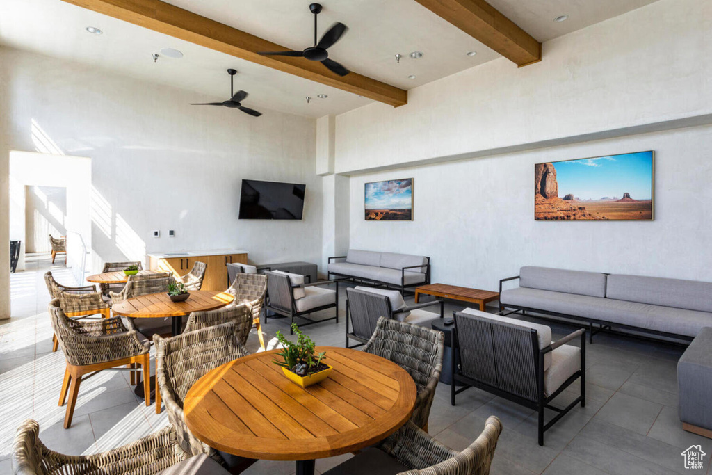 Interior space featuring an outdoor hangout area and ceiling fan