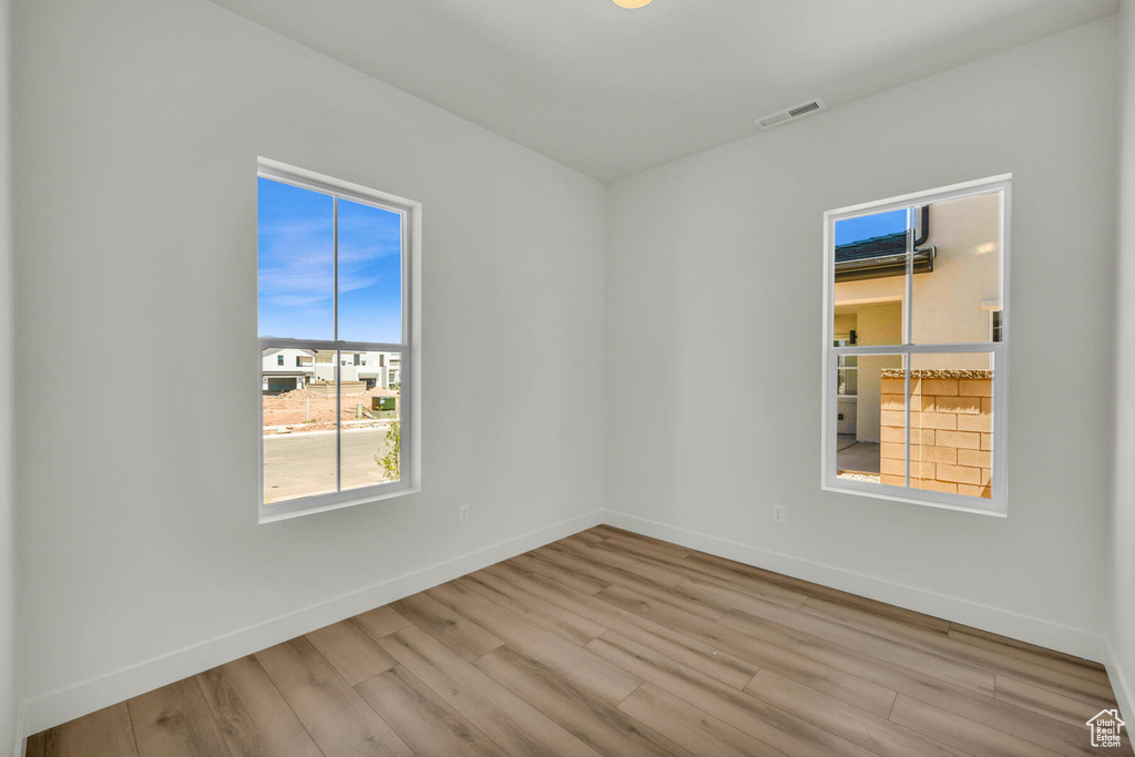 Spare room with light hardwood / wood-style floors