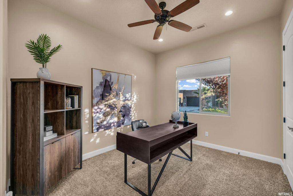 Office featuring ceiling fan and light colored carpet