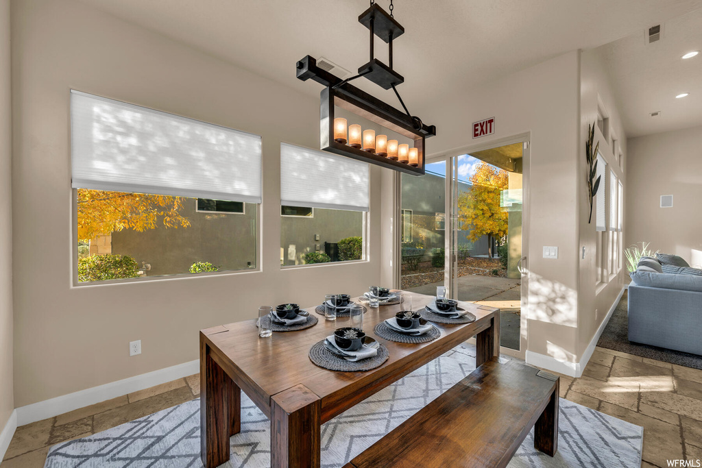 Dining area featuring a healthy amount of sunlight and tile floors