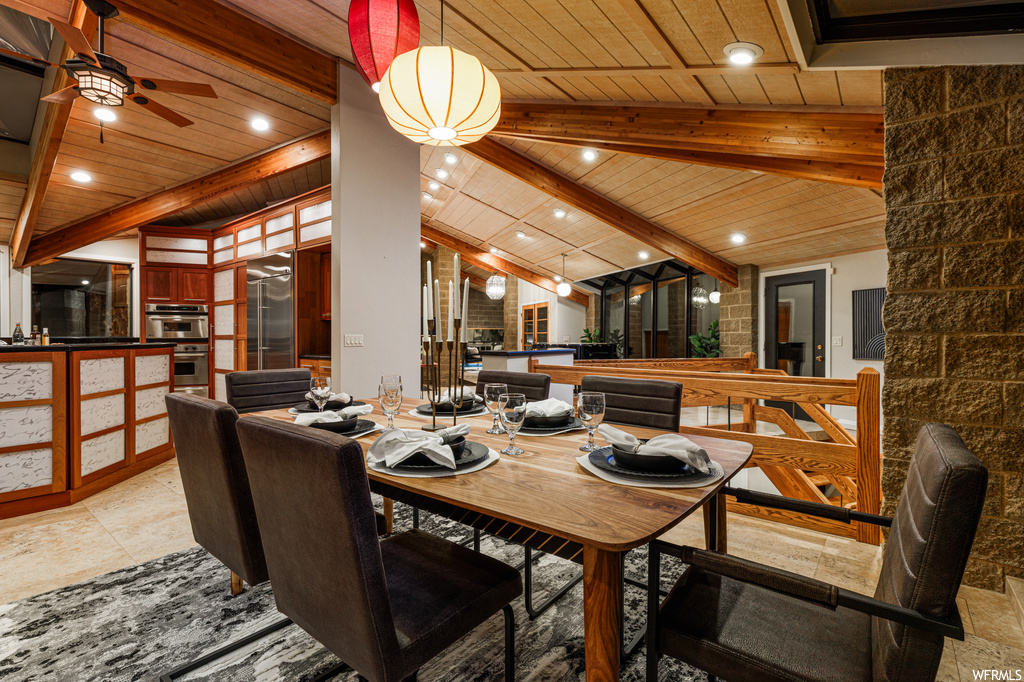 Tiled dining space featuring wooden ceiling, lofted ceiling with beams, and ceiling fan