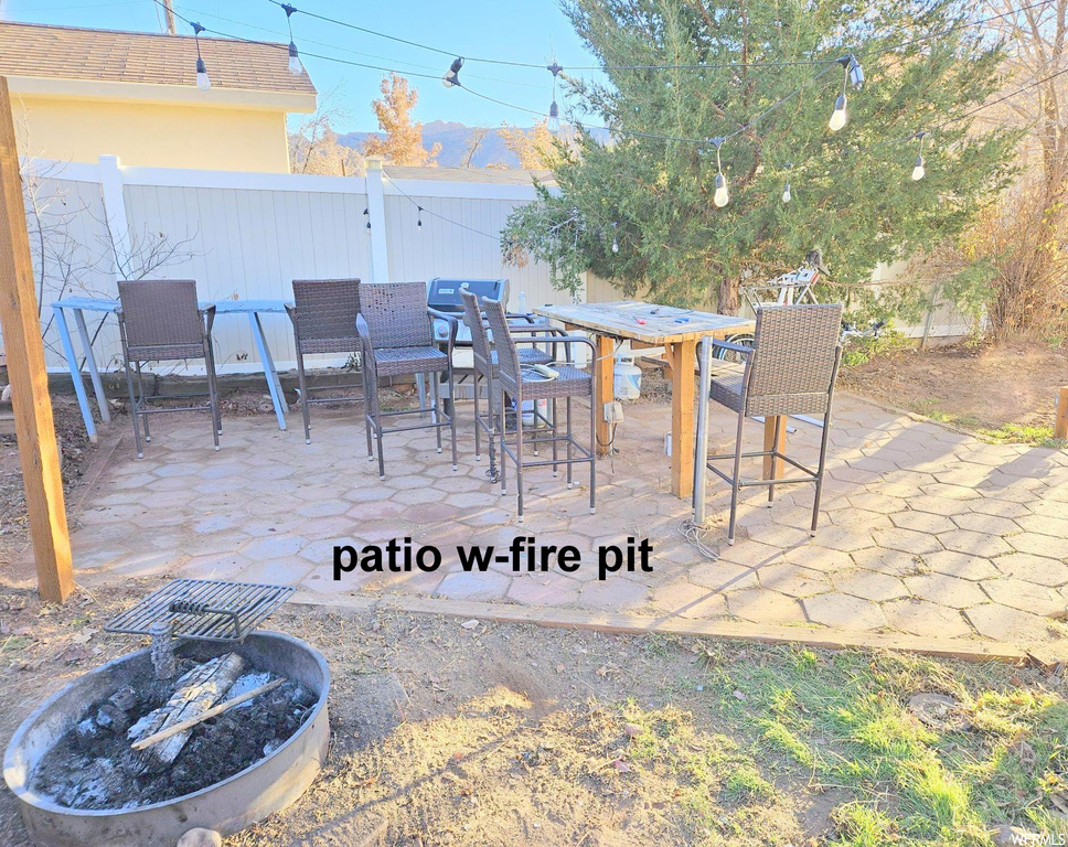 View of terrace with a fire pit