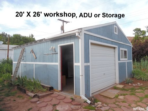 View of outdoor structure with a garage