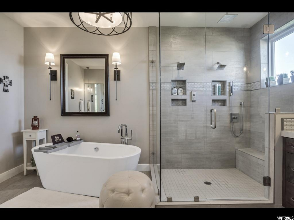 Bathroom with tile floors, plus walk in shower, and vanity
