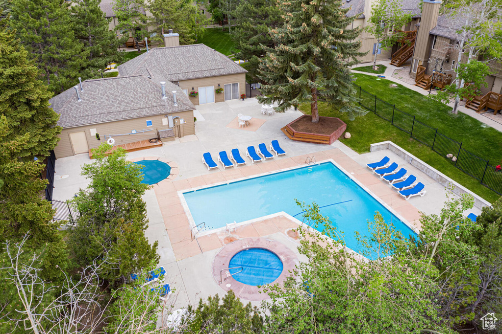 View of pool with a yard and a patio