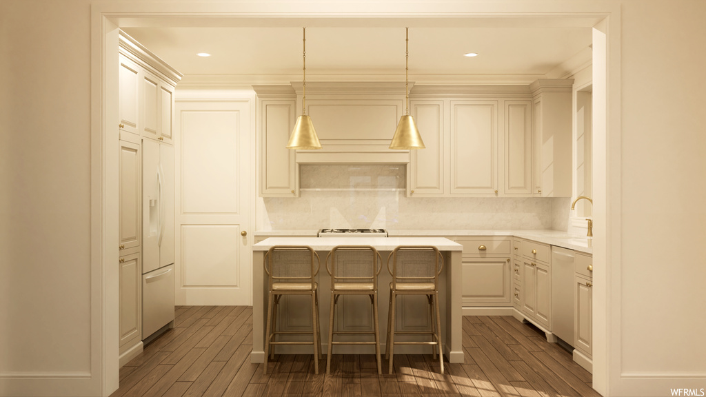 Kitchen featuring a breakfast bar, tasteful backsplash, dark wood-type flooring, and pendant lighting