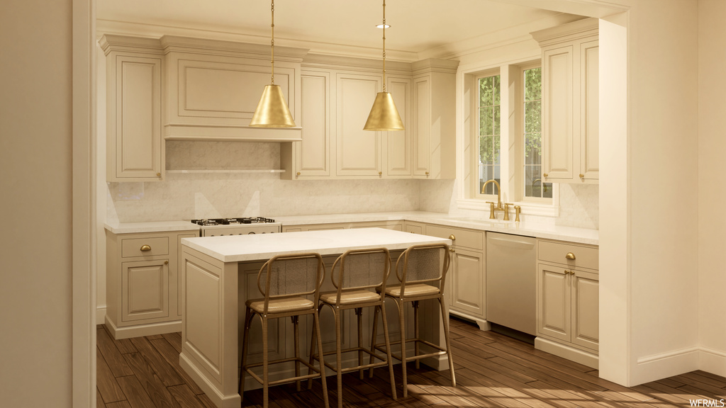 Kitchen featuring sink, pendant lighting, a center island, white dishwasher, and a kitchen breakfast bar