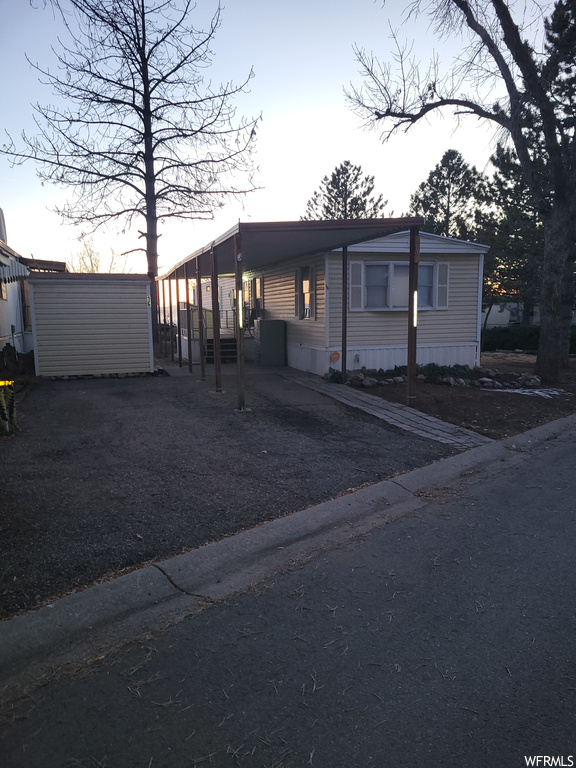 Manufactured / mobile home featuring a carport