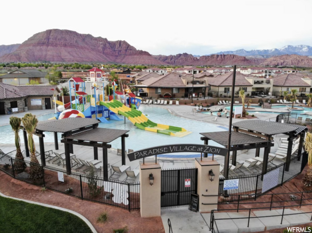 View of nearby features featuring a patio area, a swimming pool, and a mountain view