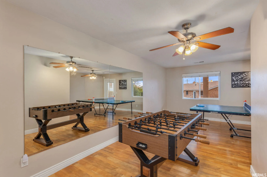 Game room featuring ceiling fan and light wood-type flooring