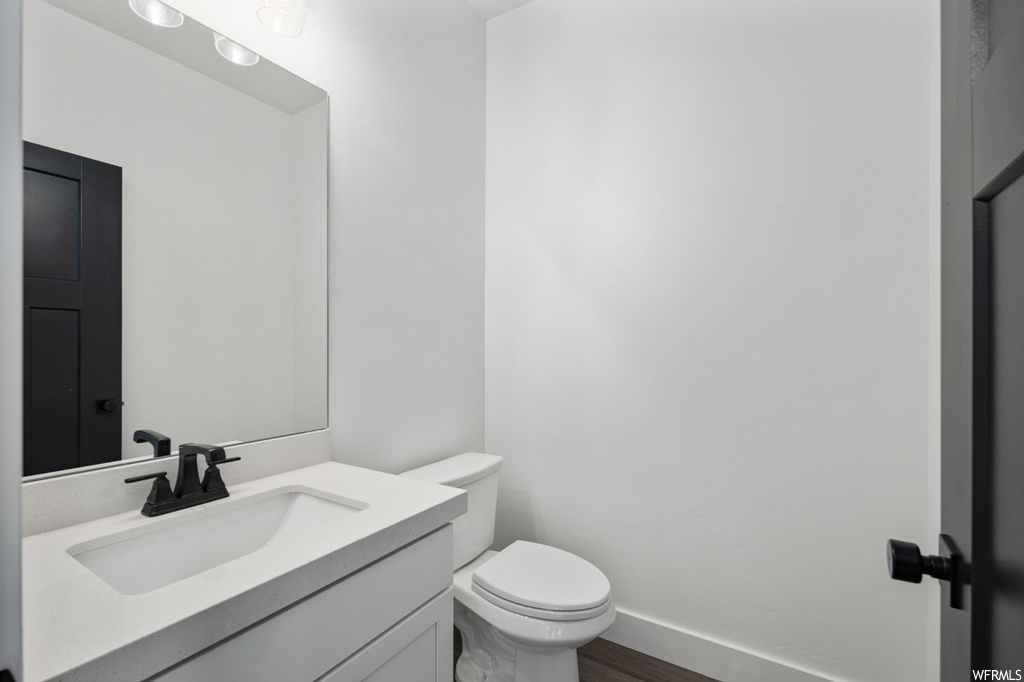 Bathroom featuring toilet and vanity