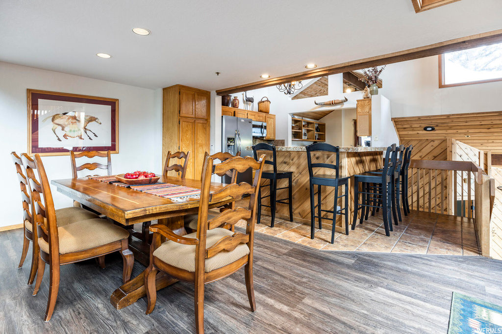 Dining area with hardwood / wood-style floors