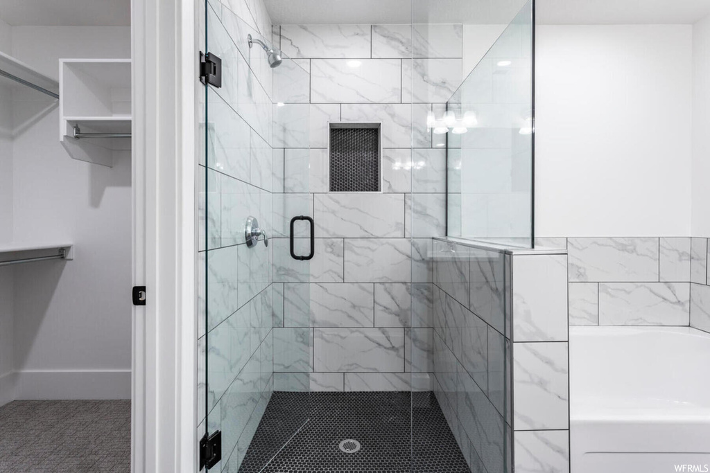 Bathroom featuring a shower with shower door