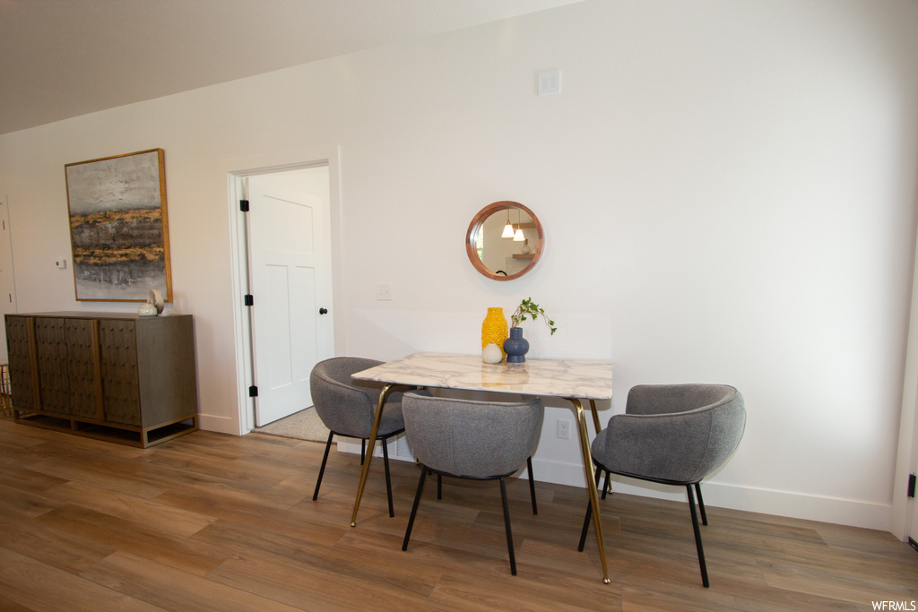 Dining space featuring hardwood / wood-style flooring